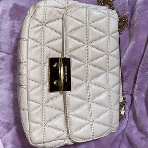 Pink Michael Kors bag with gold chain strap